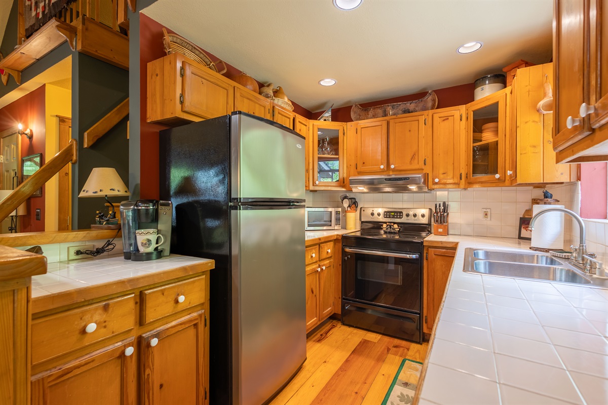 With ample counter space and an open connection to the dining area, the kitchen is designed for both comfort and practicality.