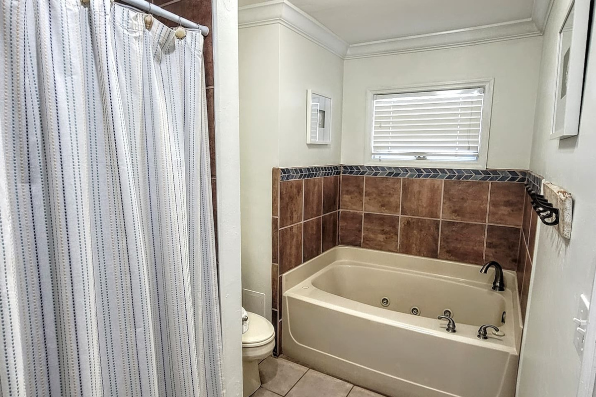 Fill the garden tub or step into the tiled shower &mdash; the master bath gives you the choice every morning and neither one is a compromise.