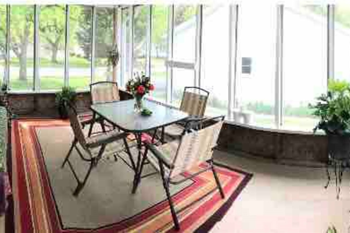 Bohemian style screened in porch. Gas grill available outside.