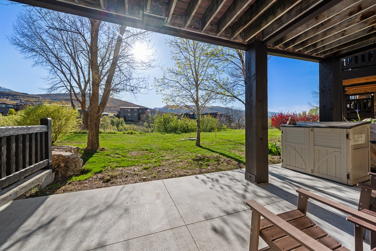 Private lower patio area offering extra outdoor living space and scenic surroundings.