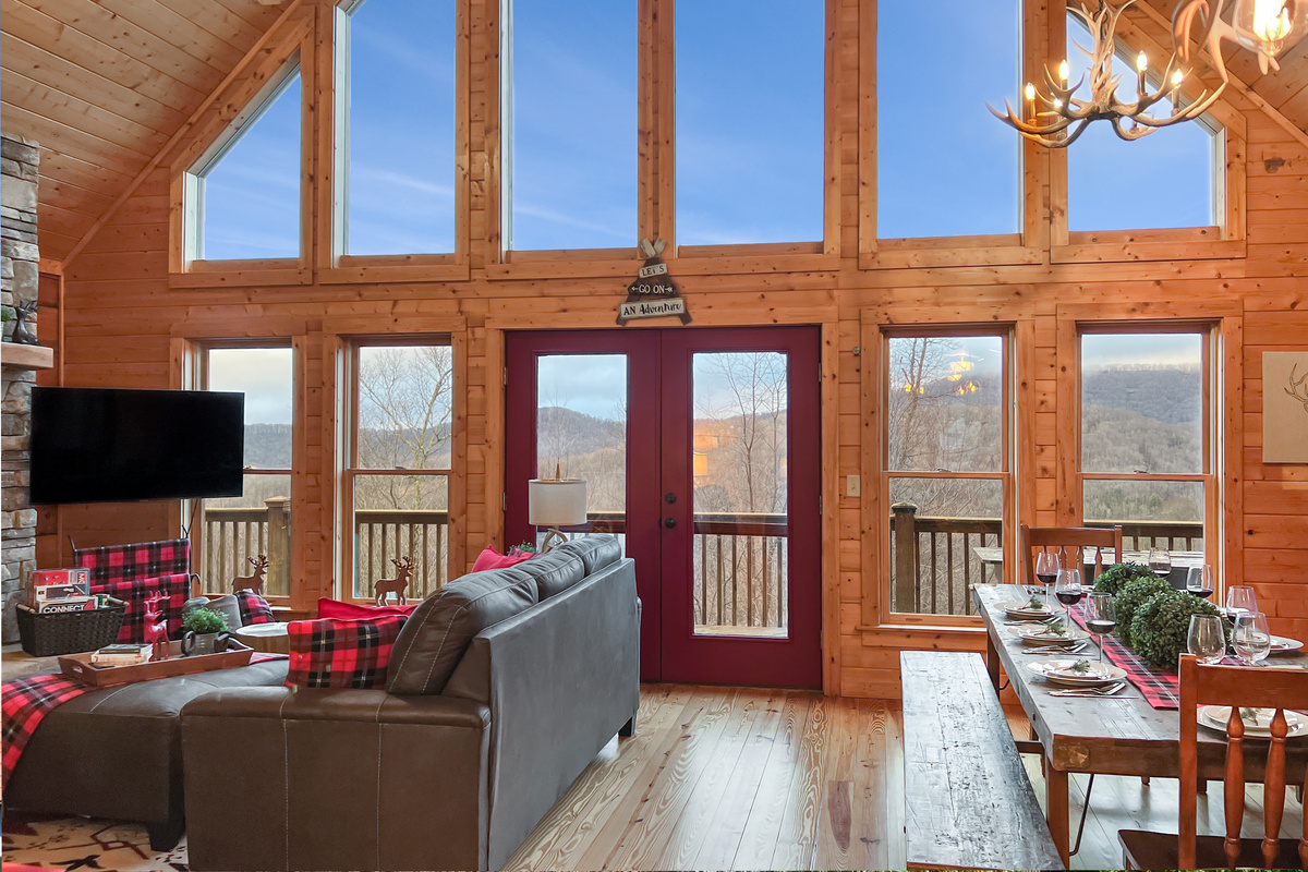 Vaulted ceilings and a wall of windows fill the great room with natural light and mountain views.