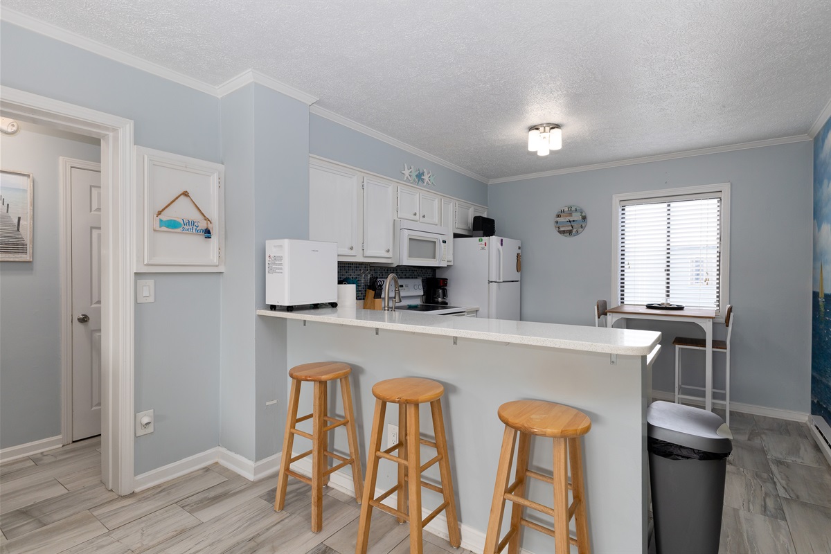 Seating for three in the dining area