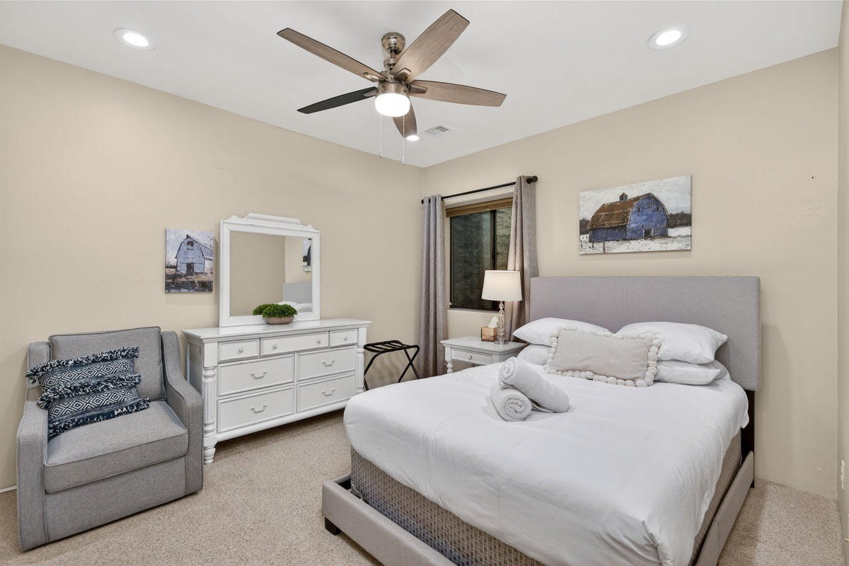 Private basement queen bedroom offers a quiet retreat space ideal for extended stays