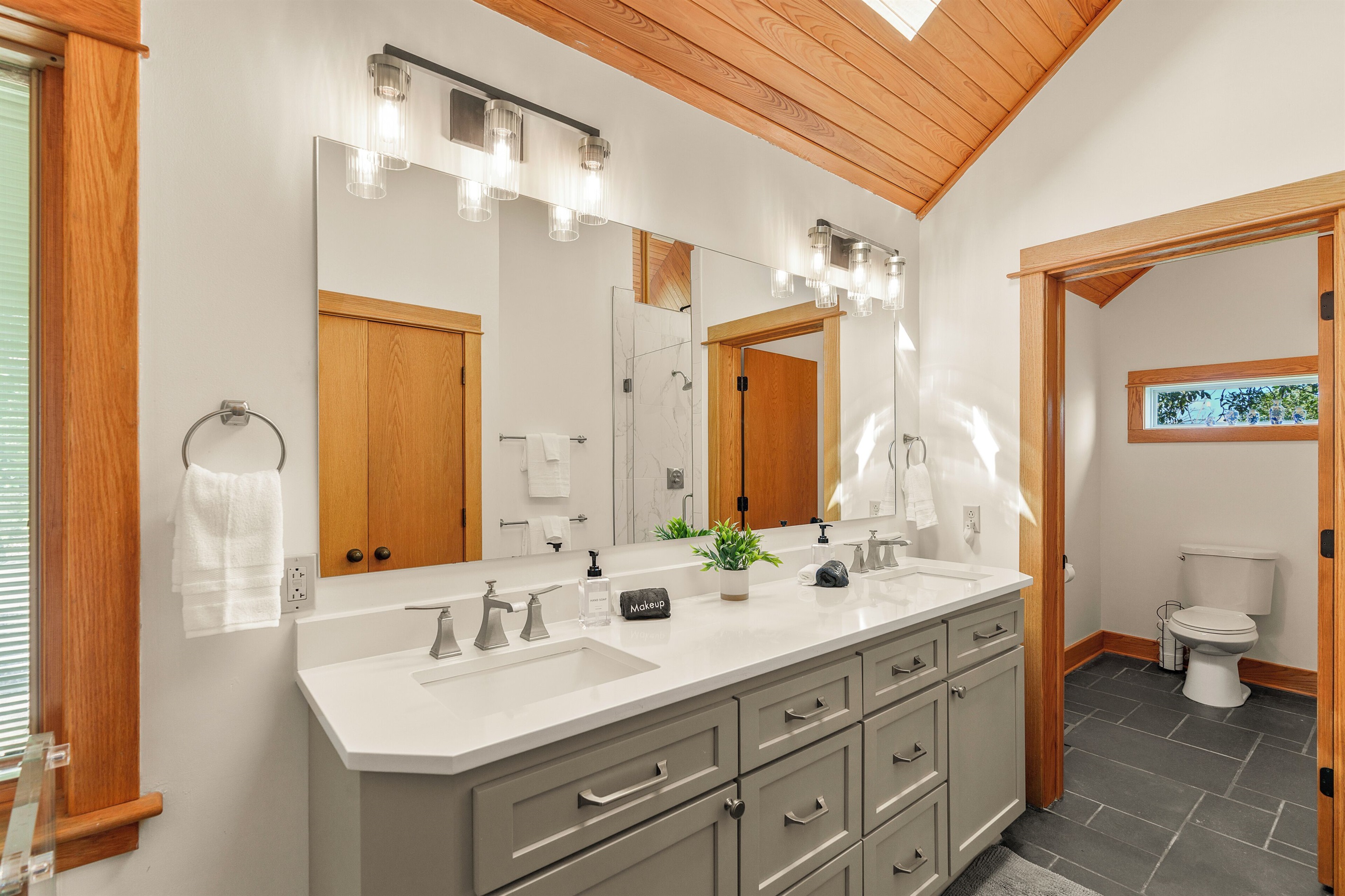 Ensuite bathroom to BR1 with dual vanities and massive shower
