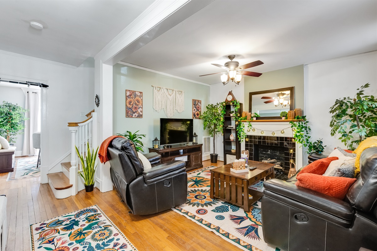 Living Room: Bright and inviting space perfect for relaxation and entertaining! Enjoy the vibrant decor.