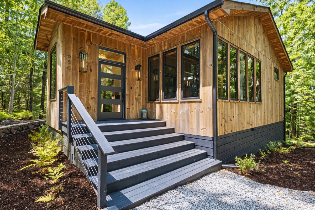 Another angle of the cabin&rsquo;s exterior, highlighting its modern design and spacious layout.