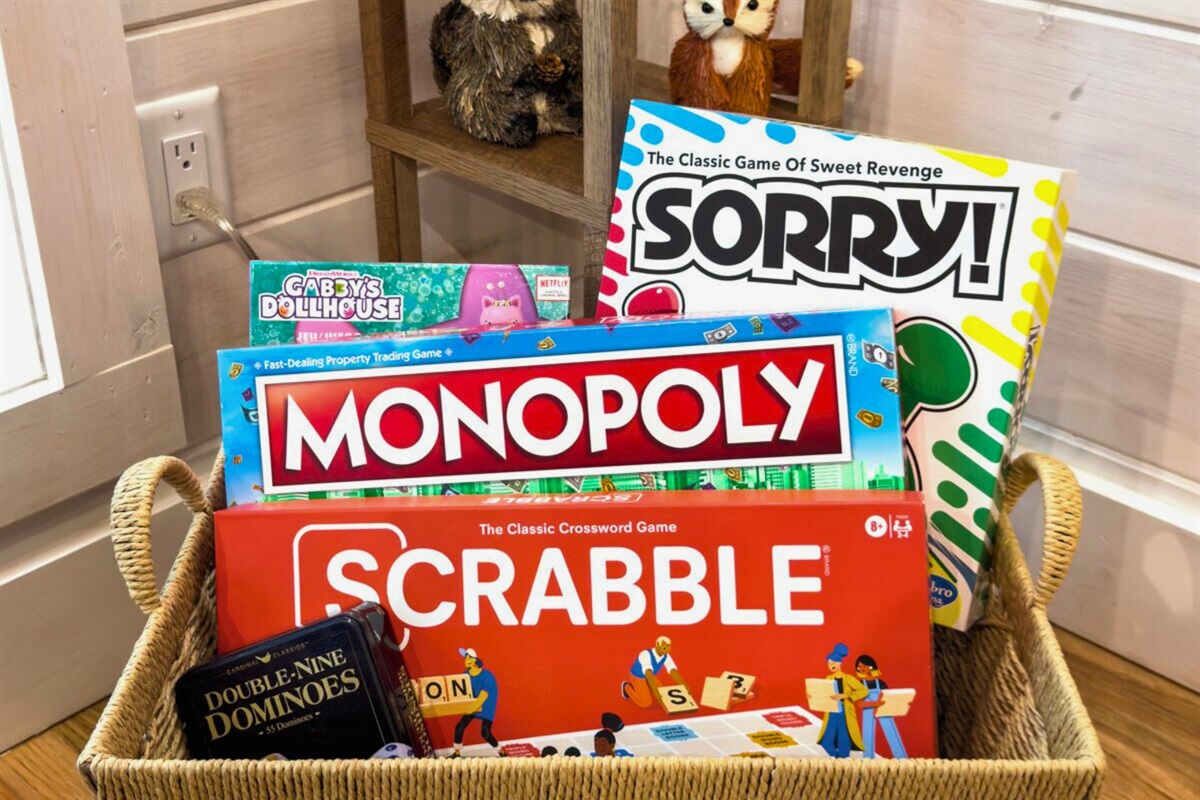 Game corner with board games including Monopoly and Scrabble.