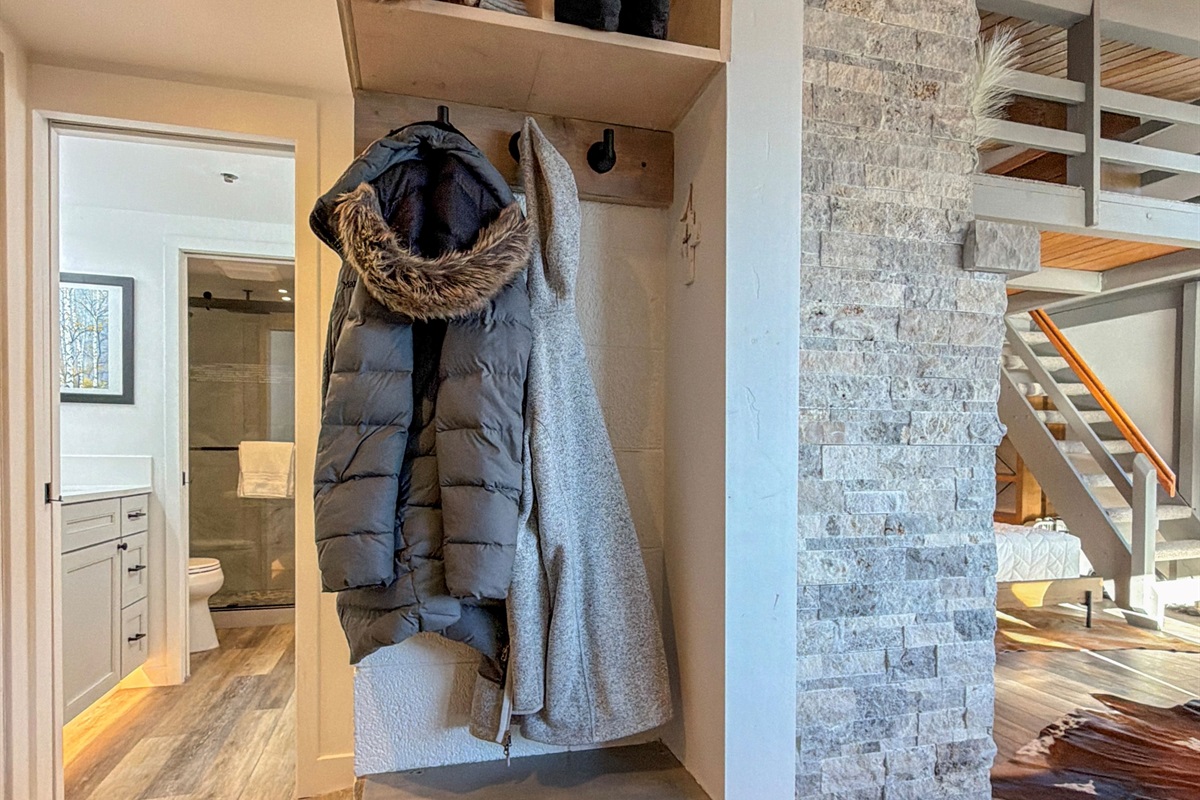 Back in the entryway, your enjoy plenty of storage space for your adventure items and access to the bathroom…