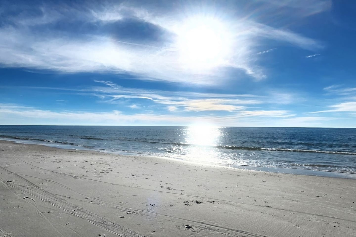 Step off the boardwalk and your feet hit the sand &mdash; the beach is a one-minute walk from your front door.