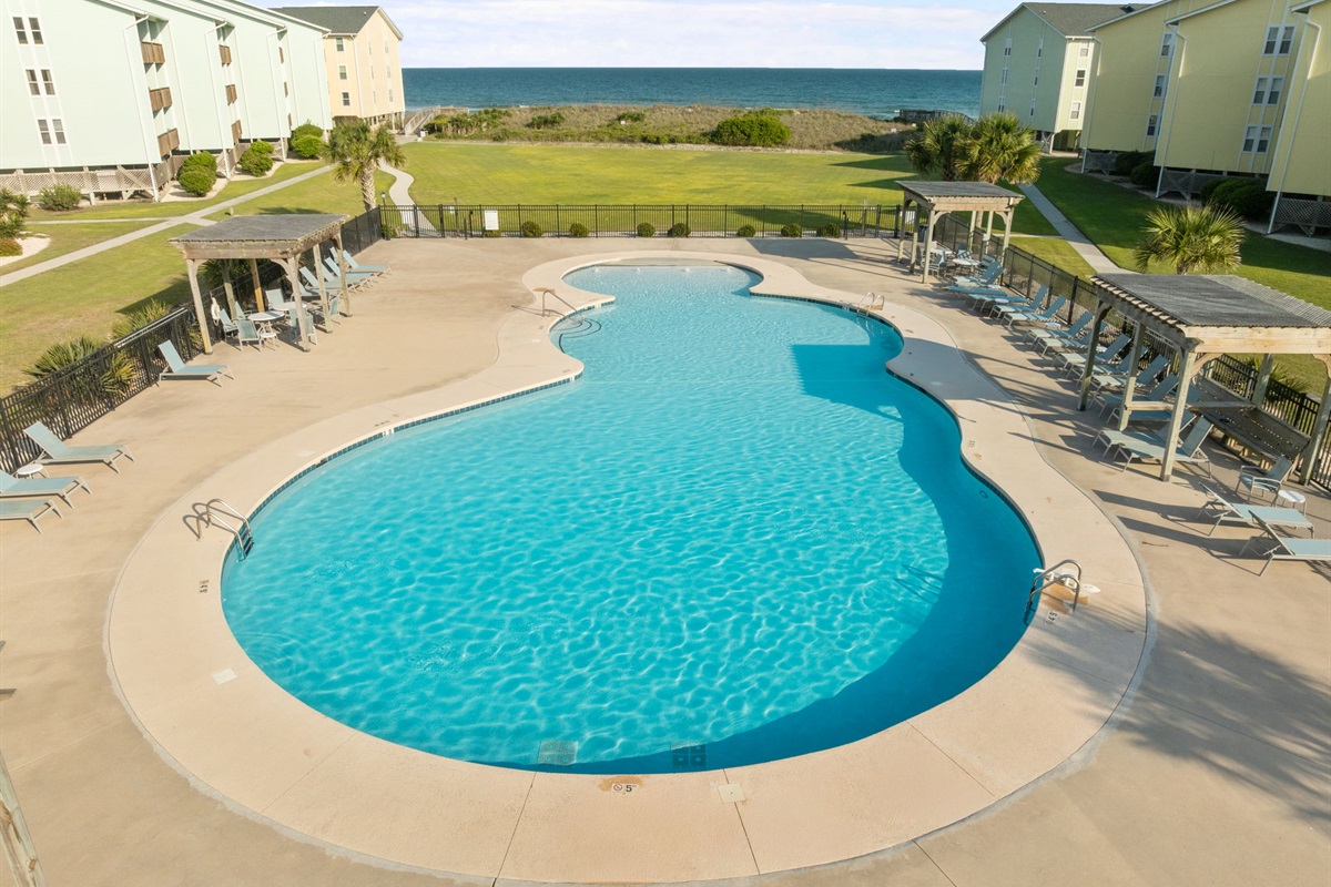 Resort-style seasonal pool just steps from the beach