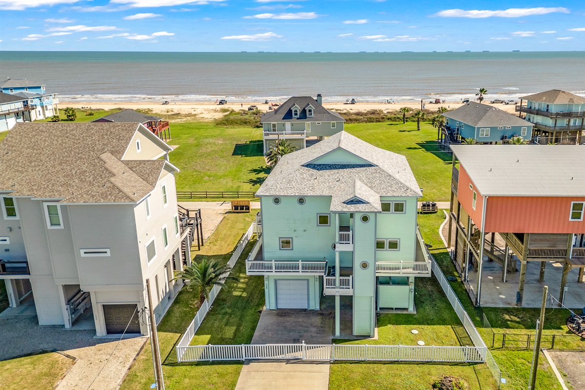 Crystal Paradise Exterior: Welcome to your coastal escape, this is the home and ocean scenery that will set the tone for your entire stay.