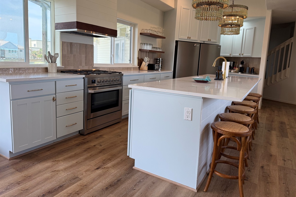 Double fridges, an island that seats 6, an ice maker, crock pot, toaster for 4,   