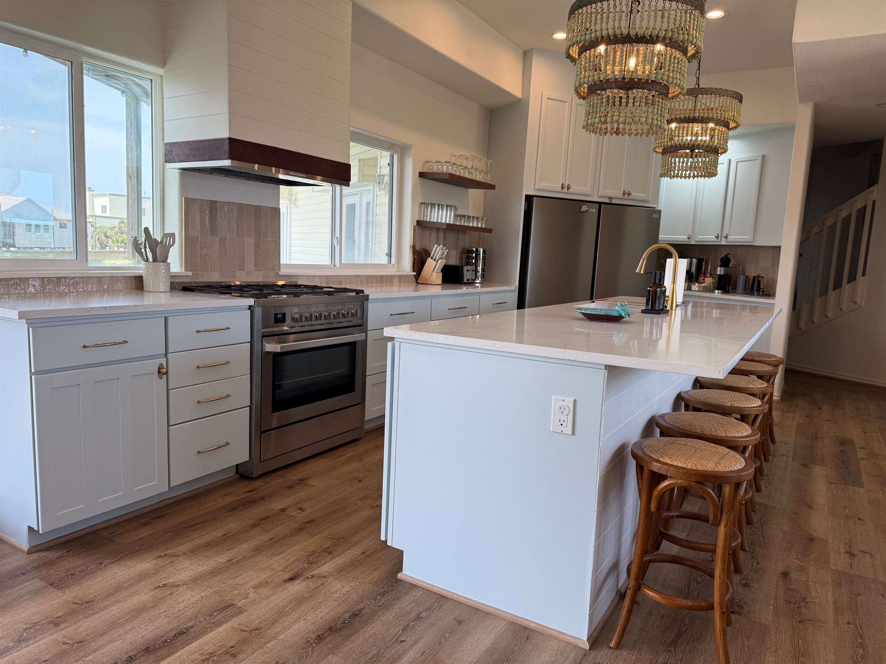 Double fridges, an island that seats 6, an ice maker, crock pot, toaster for 4,   