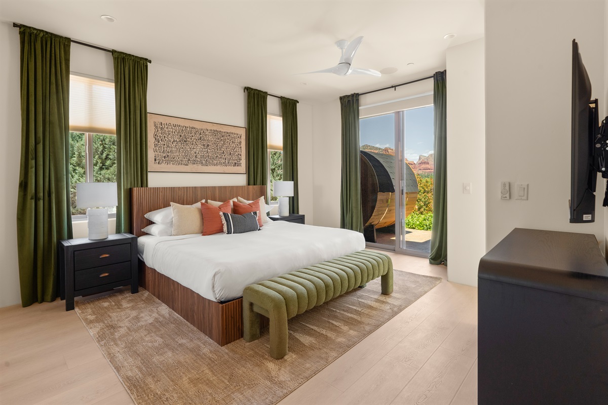 Step out of bed and into relaxation. This stunning guest suite features premium furnishings, red rock views, and direct private access to our outdoor barrel sauna.