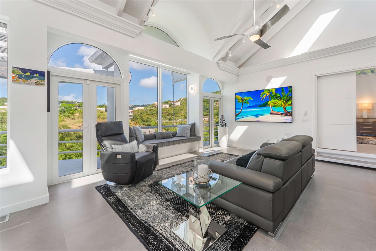 Bright living room with comfy seating and Smart TV