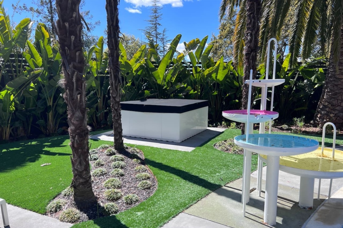 6 person luxury Aquatica hot tub is installed pool-side