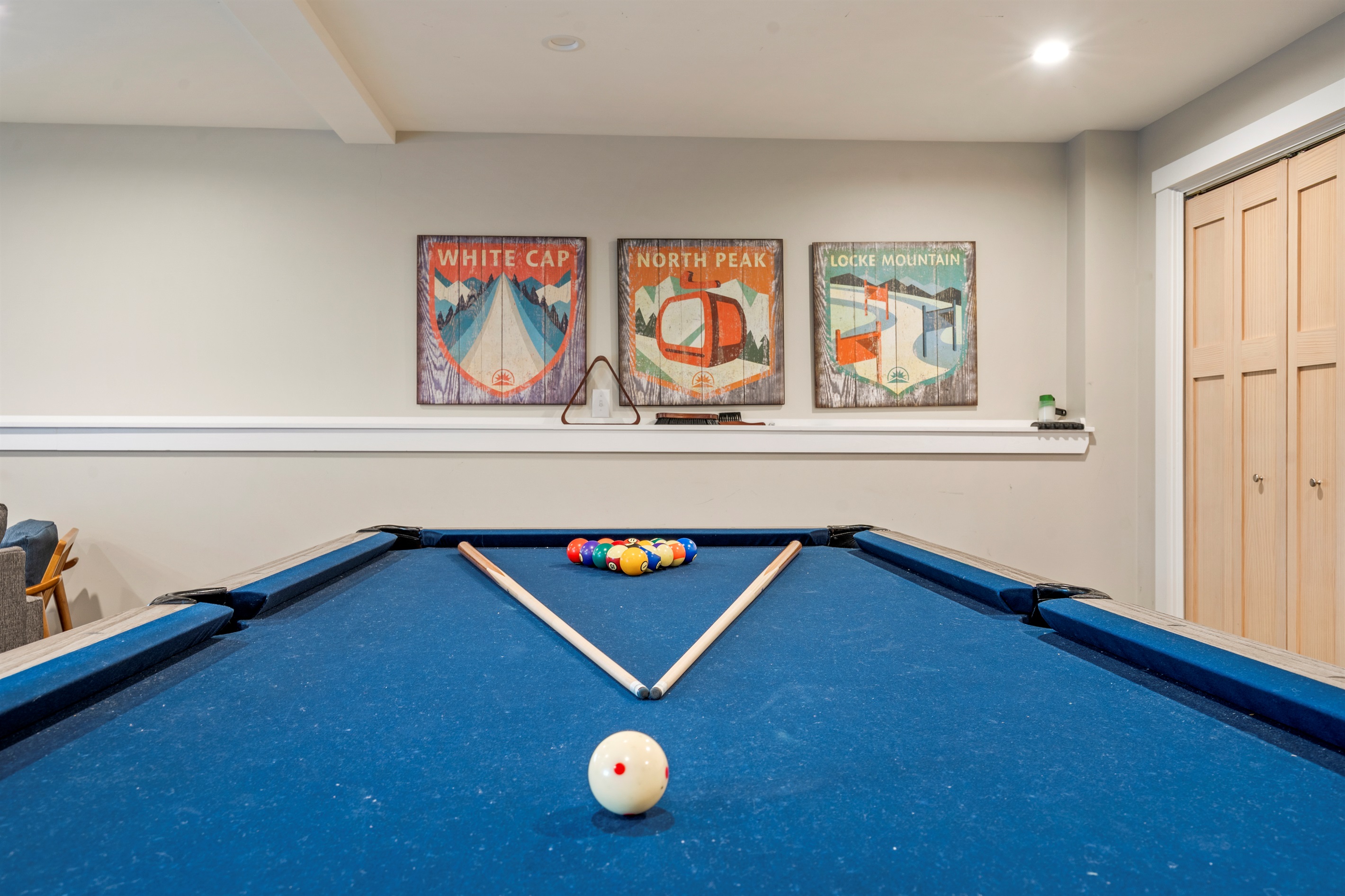 Your Entertainment Hub: Full-size pool table and room to relax after a day on the mountain.