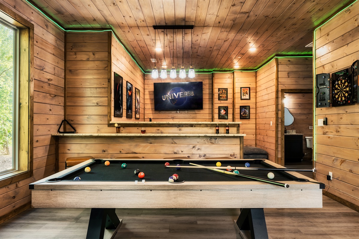 Game room with pool table, foosball table, arcades, board games, theater and half bath