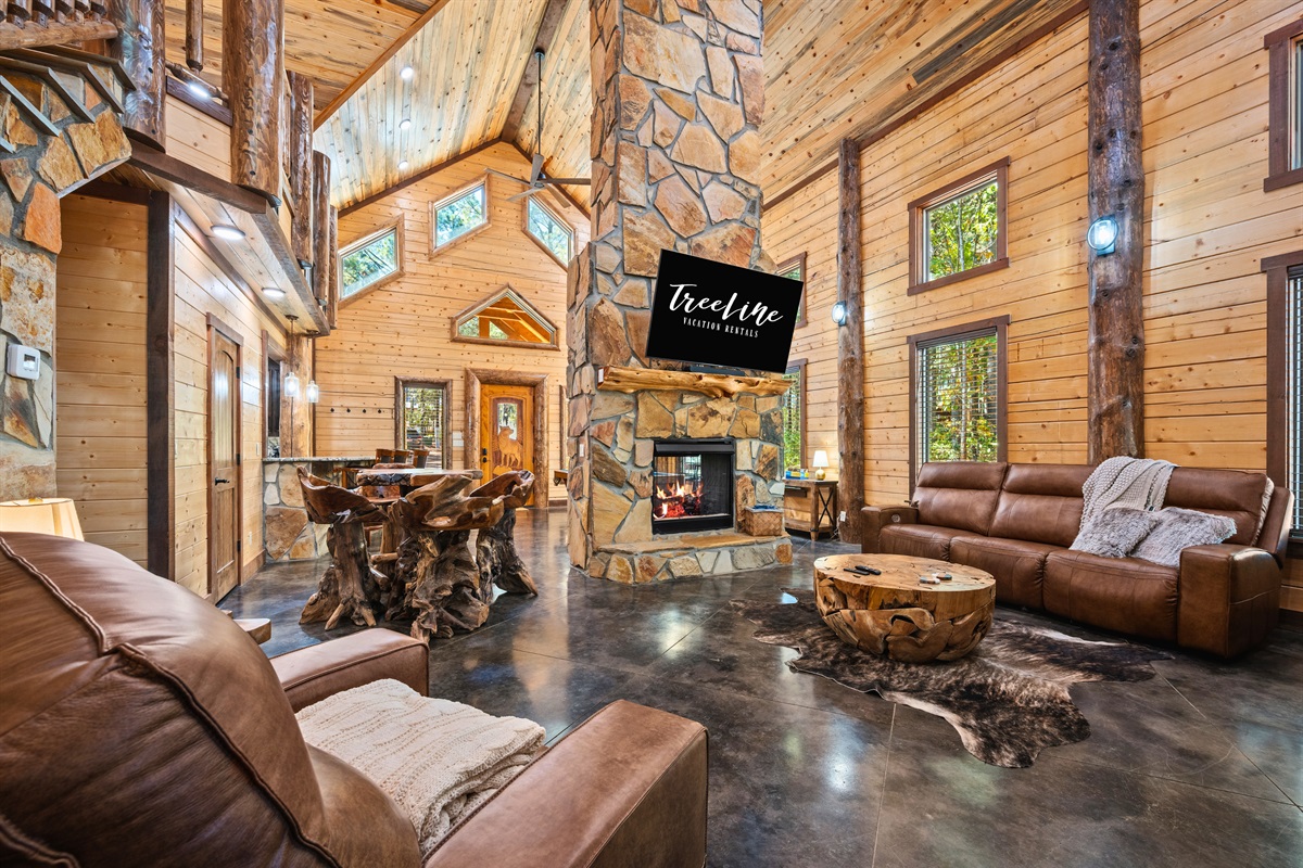 Spacious open-concept living area with vaulted ceilings.