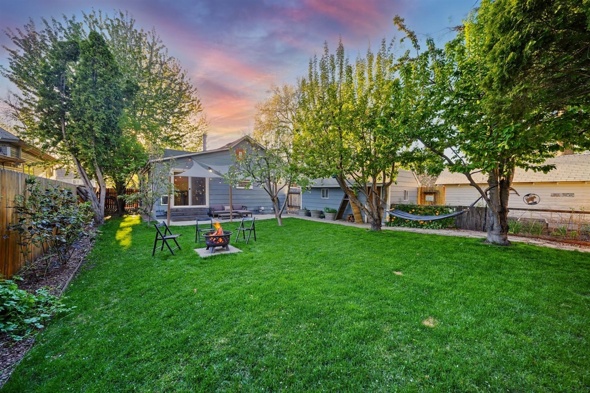 Private, shaded & fenced back yard with seasonal fire pit. 