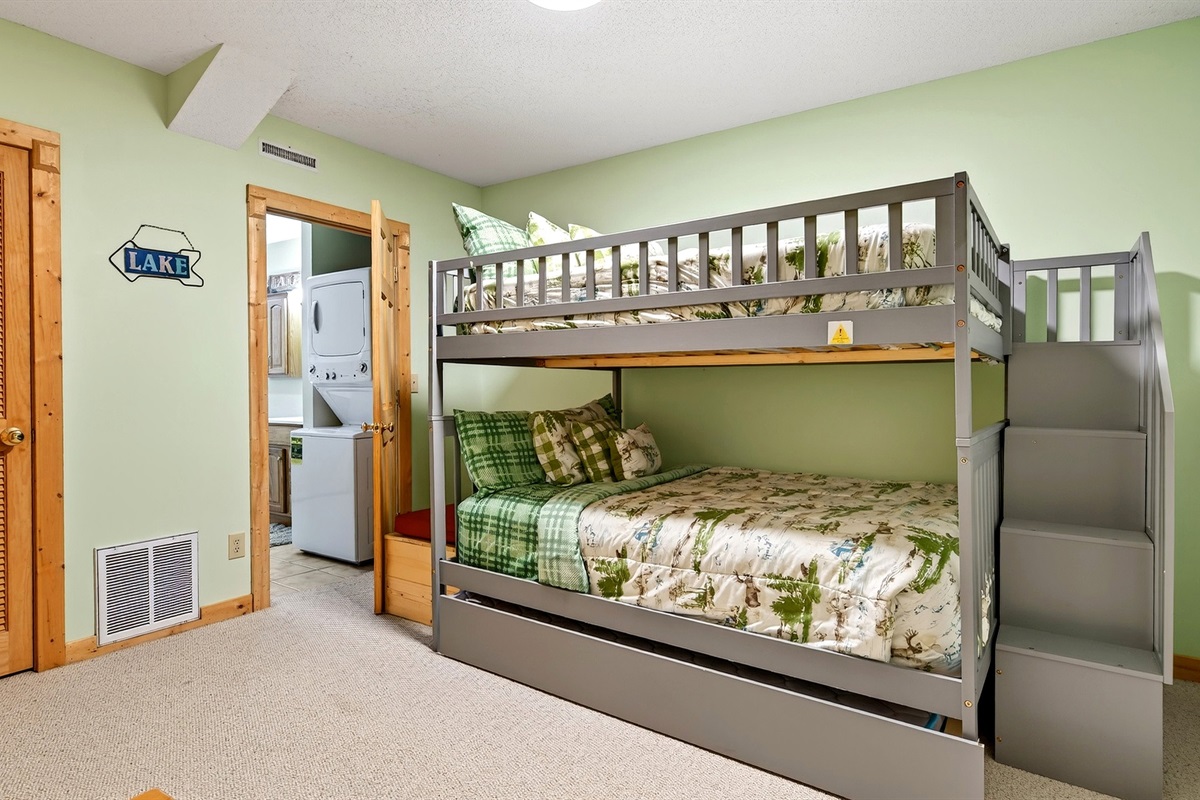 Lower level bedroom with queen bunk beds