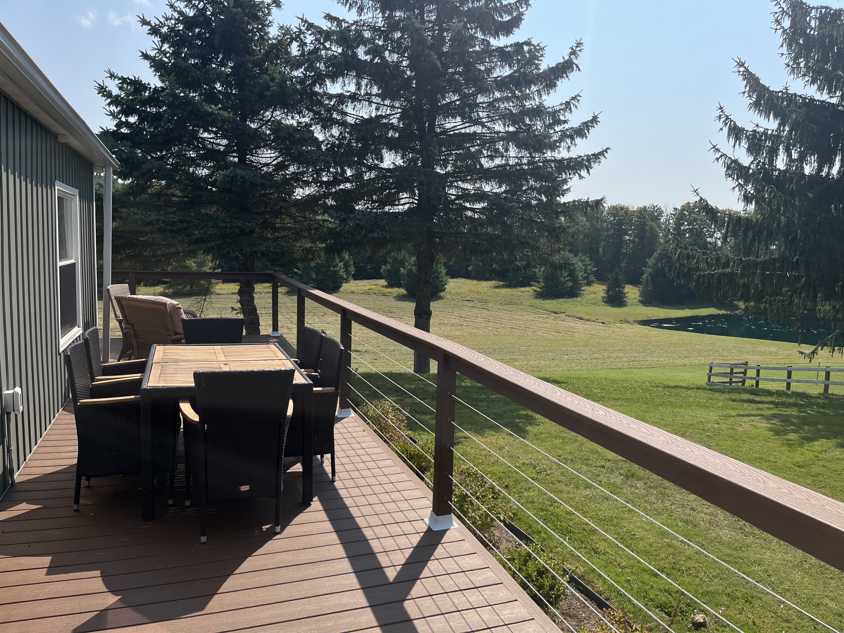 Large wrap around deck with pond(s) view