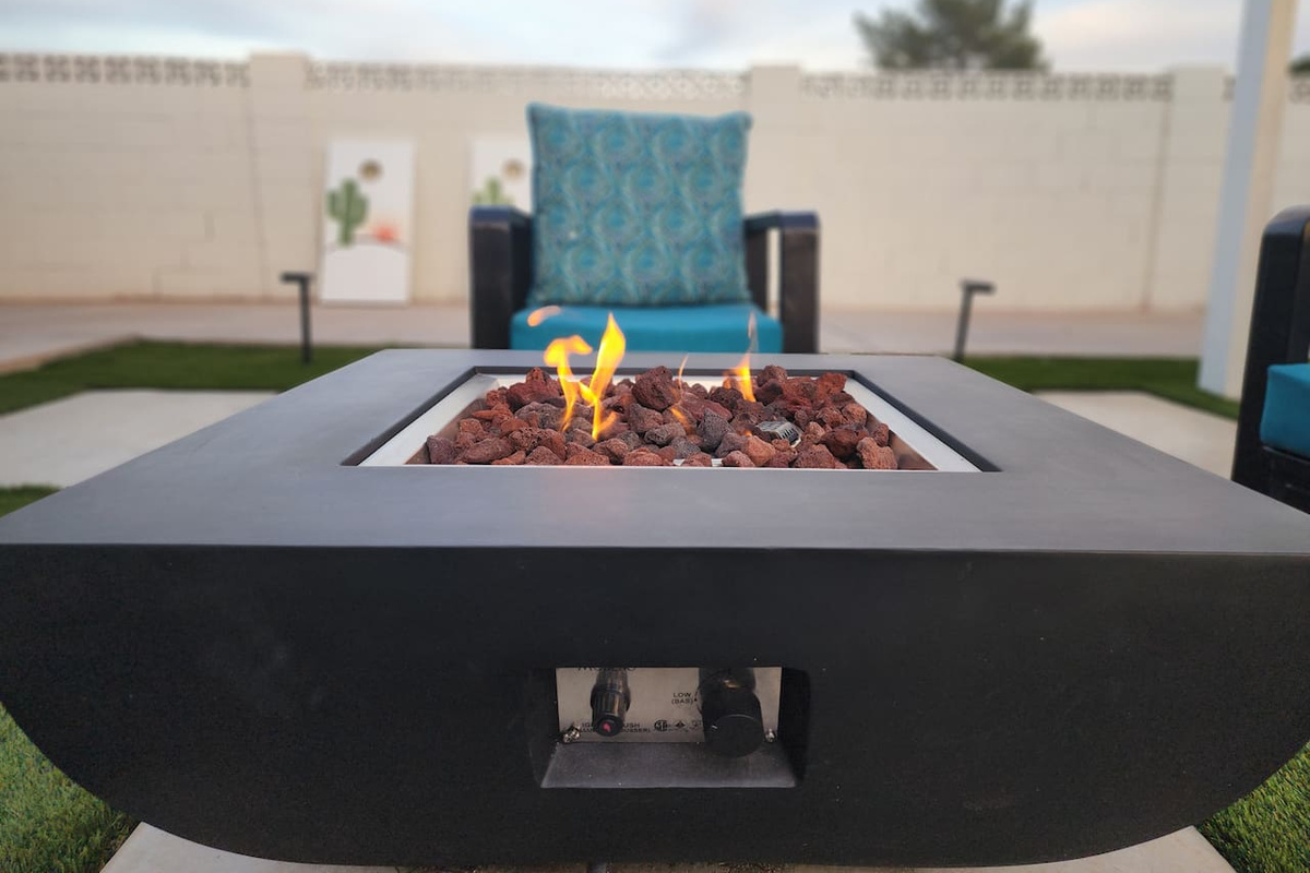 Comfortable seating around the fire pit is perfect for evening conversations and enjoying the peaceful desert atmosphere while you watch the sunset from your private backyard.