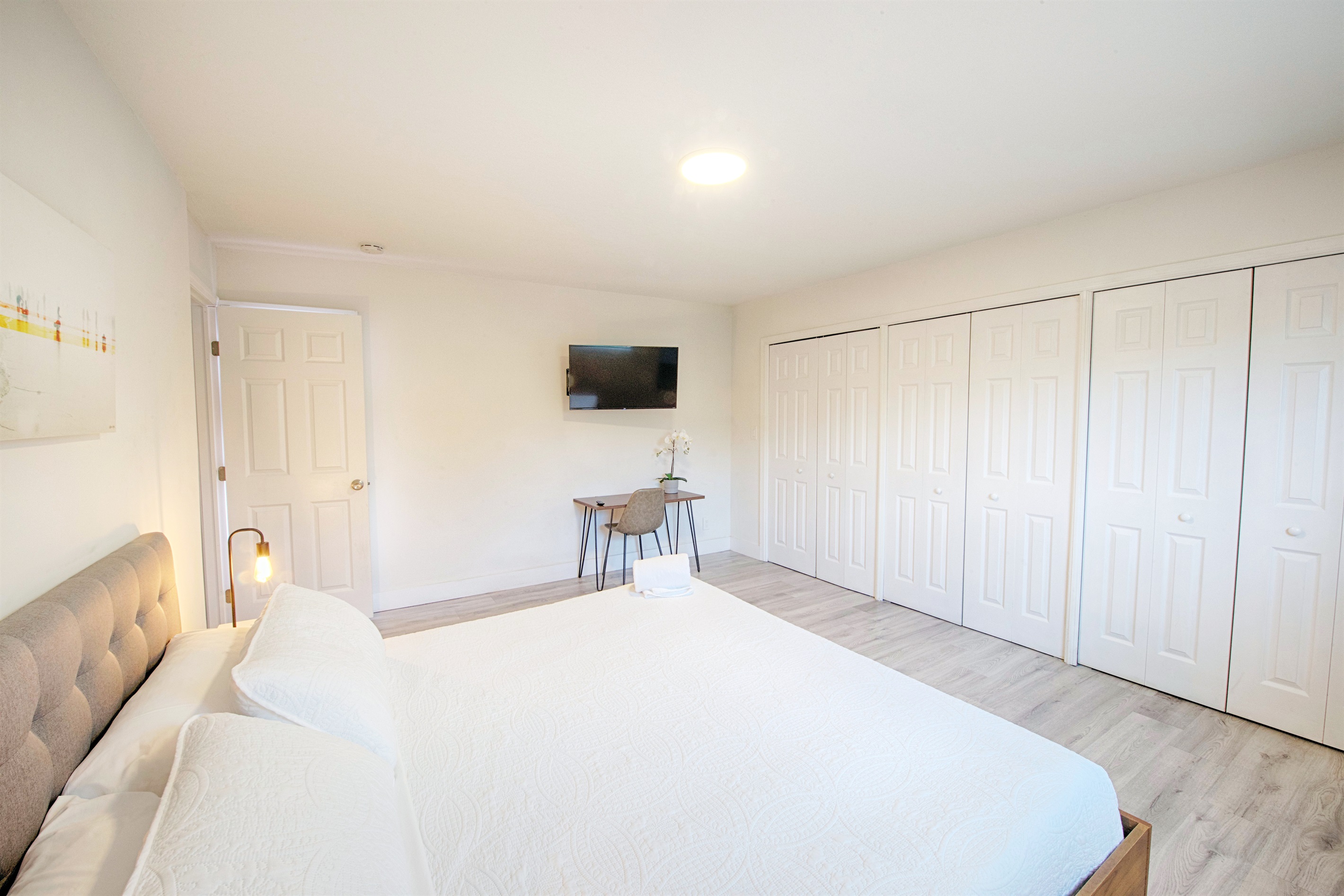Second view of primary bedroom with partial ocean view looking east.