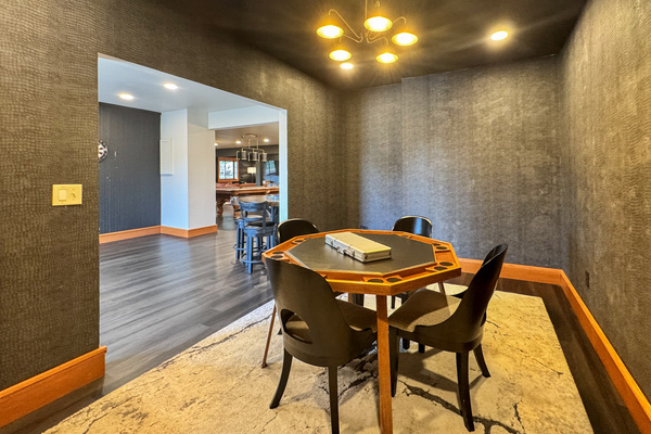 Poker room with a dedicated card table and seating.