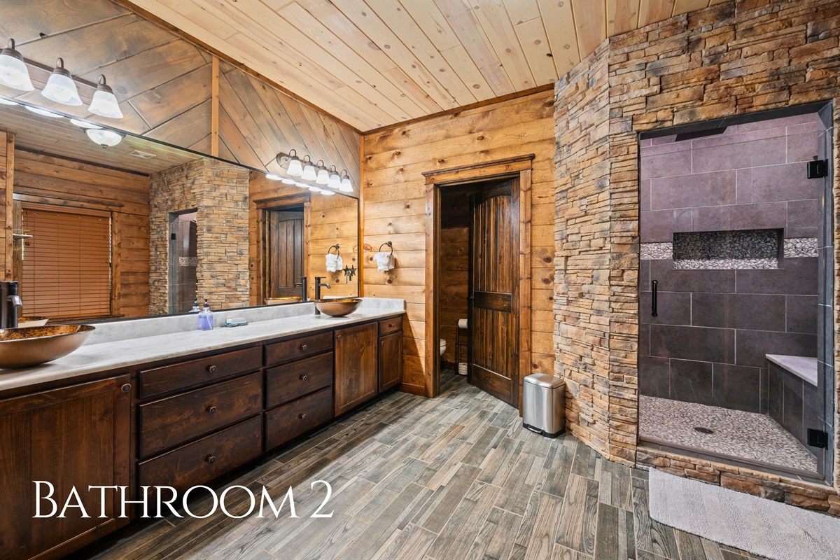 Another full bathroom features a walk-in shower and plenty of counter space for added convenience.