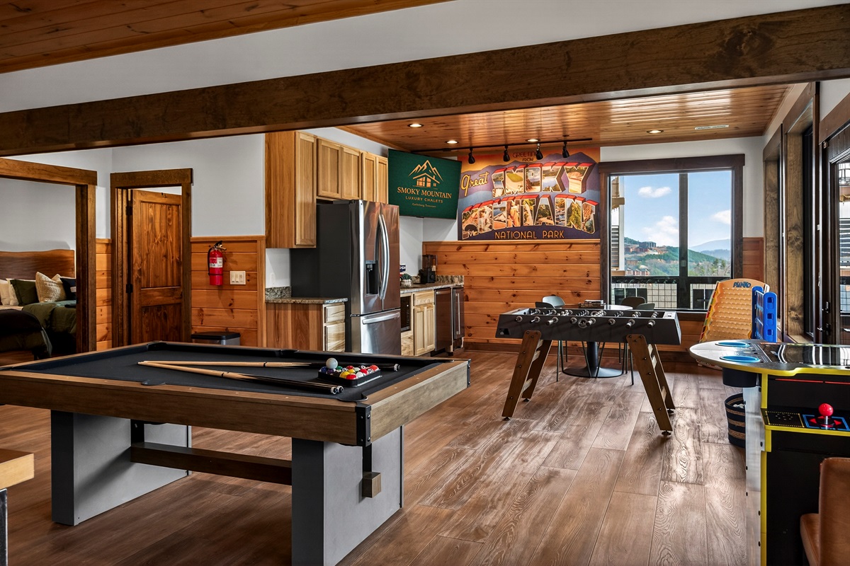 The perfect hangout after a day exploring the Smokies. Enjoy hours of fun with pool, shuffleboard, foosball & classic arcade tables plus a convenient kitchenette for snacks and drinks. This entertainment-packed space is designed for family fun, game nights