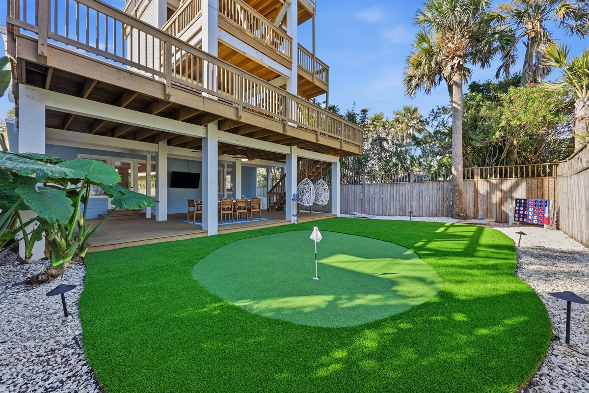 A backyard designed for fun - putting green + palms + total privacy
