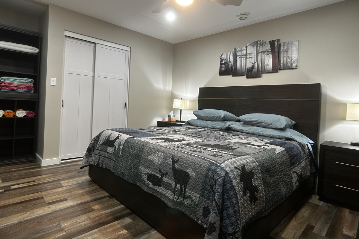 King size bed, dimmable lights, room darkening curtains and ceiling fan.