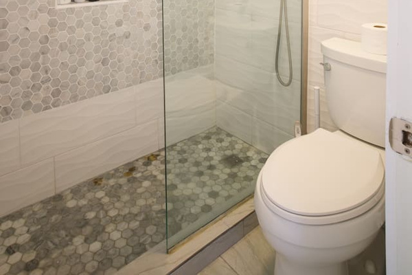 Remodeled bathroom with walk in shower and rain shower head