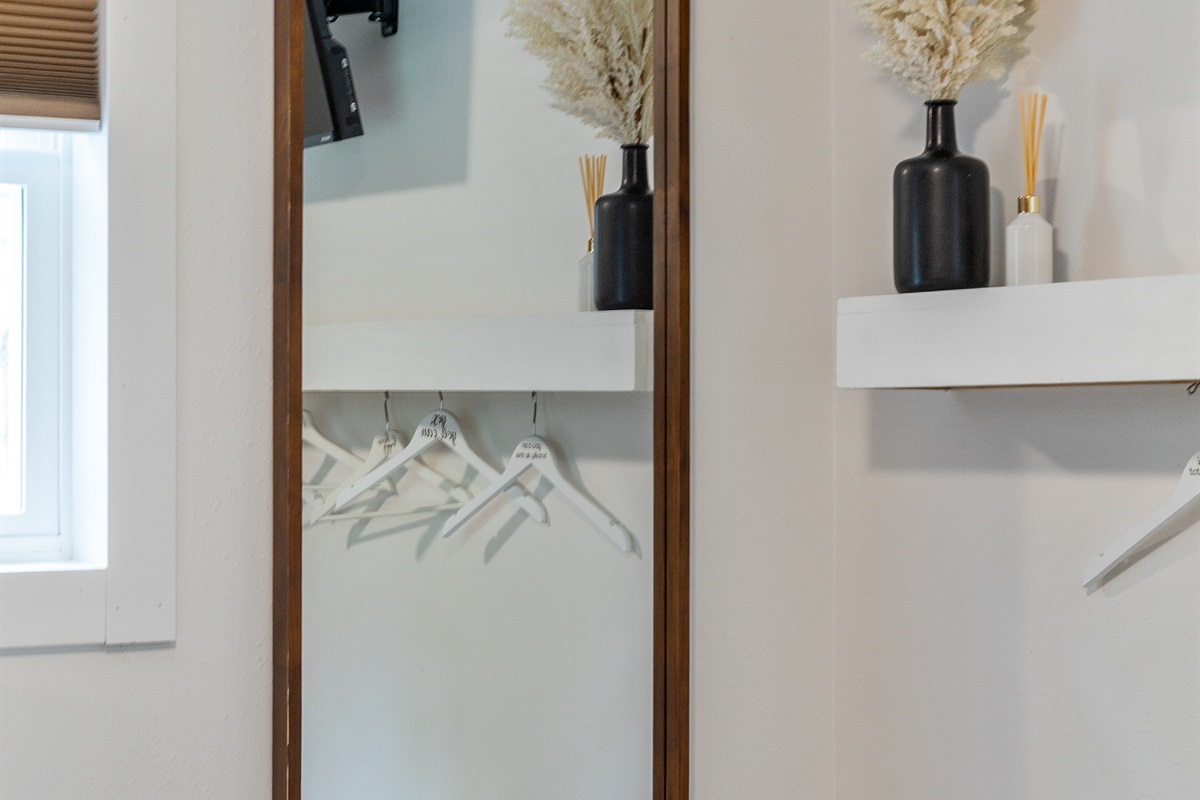Get ready with ease thanks to the convenient full-length mirror in the bedroom.
