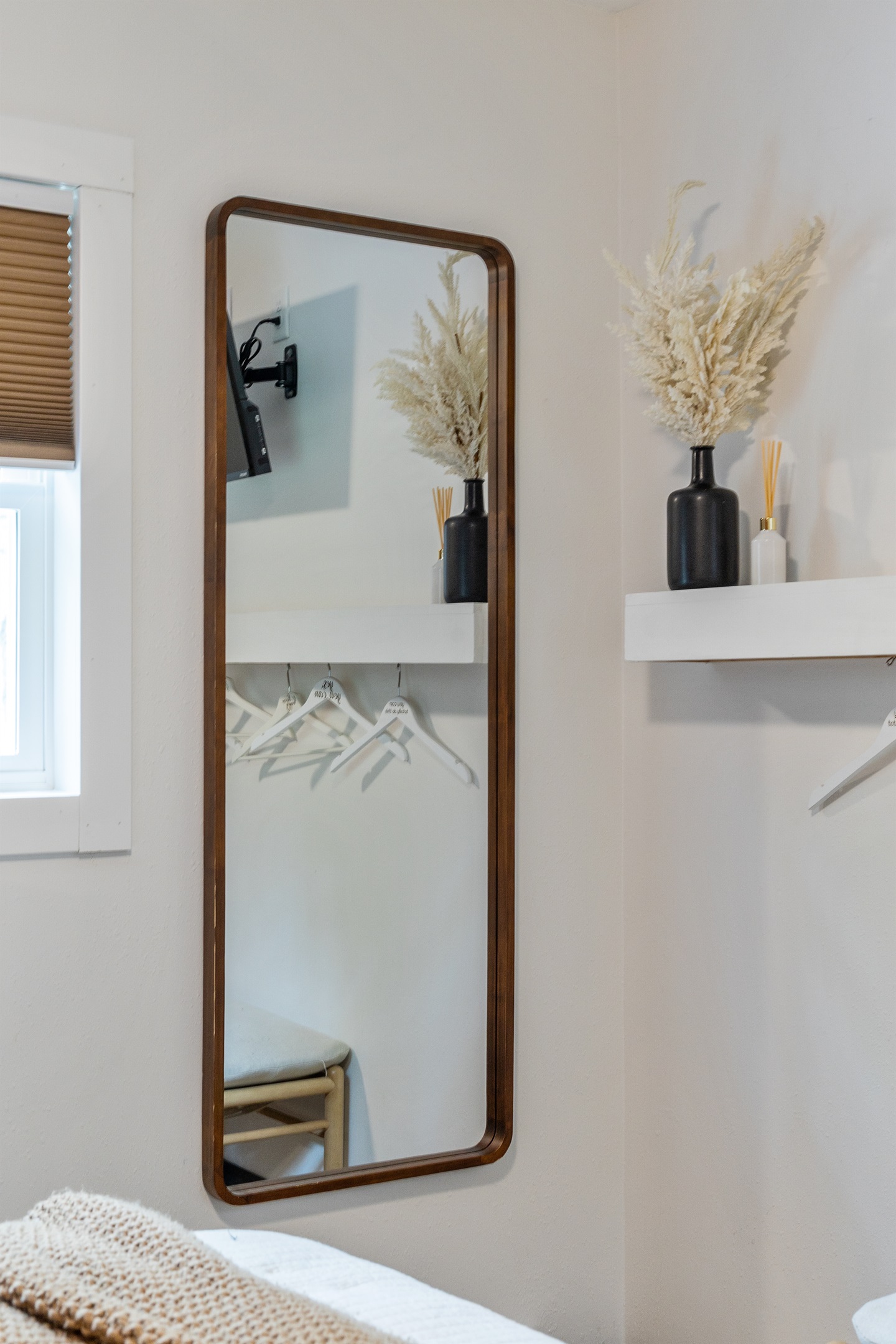 Get ready with ease thanks to the convenient full-length mirror in the bedroom.