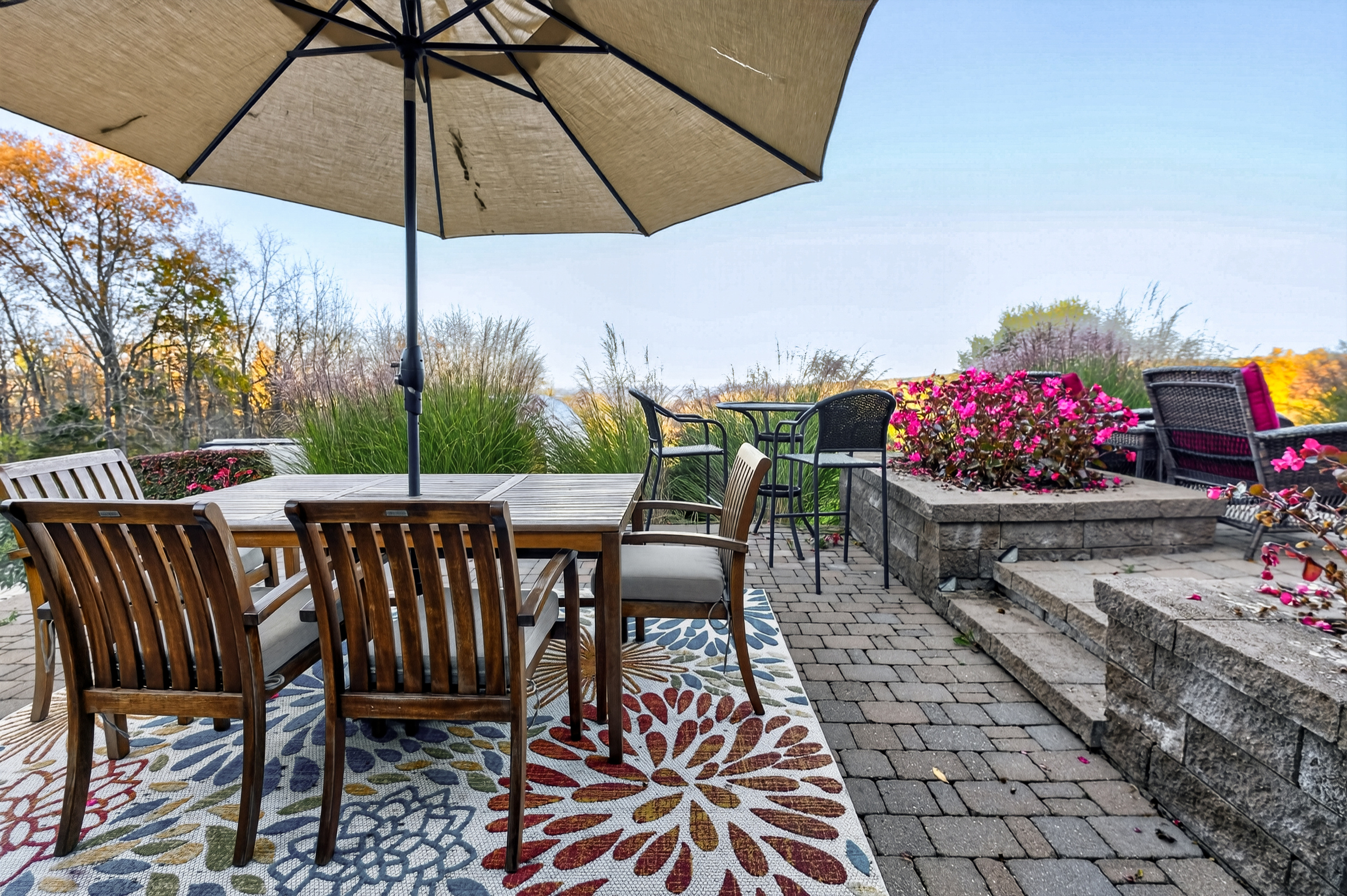 Outdoor dining table beneath a patio umbrella