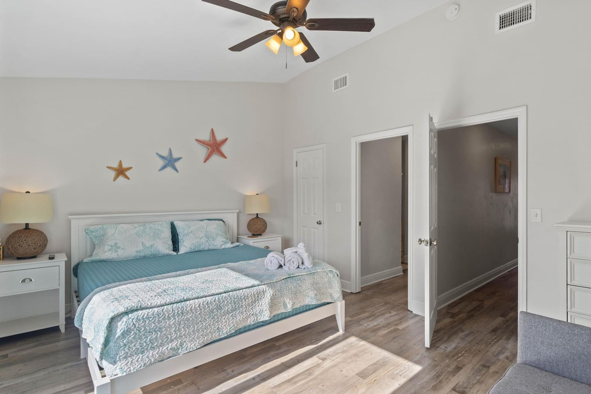 Claim the king suite and finally sleep the way vacation promises &mdash; room to breathe, morning light waiting on the other side of that deck door.