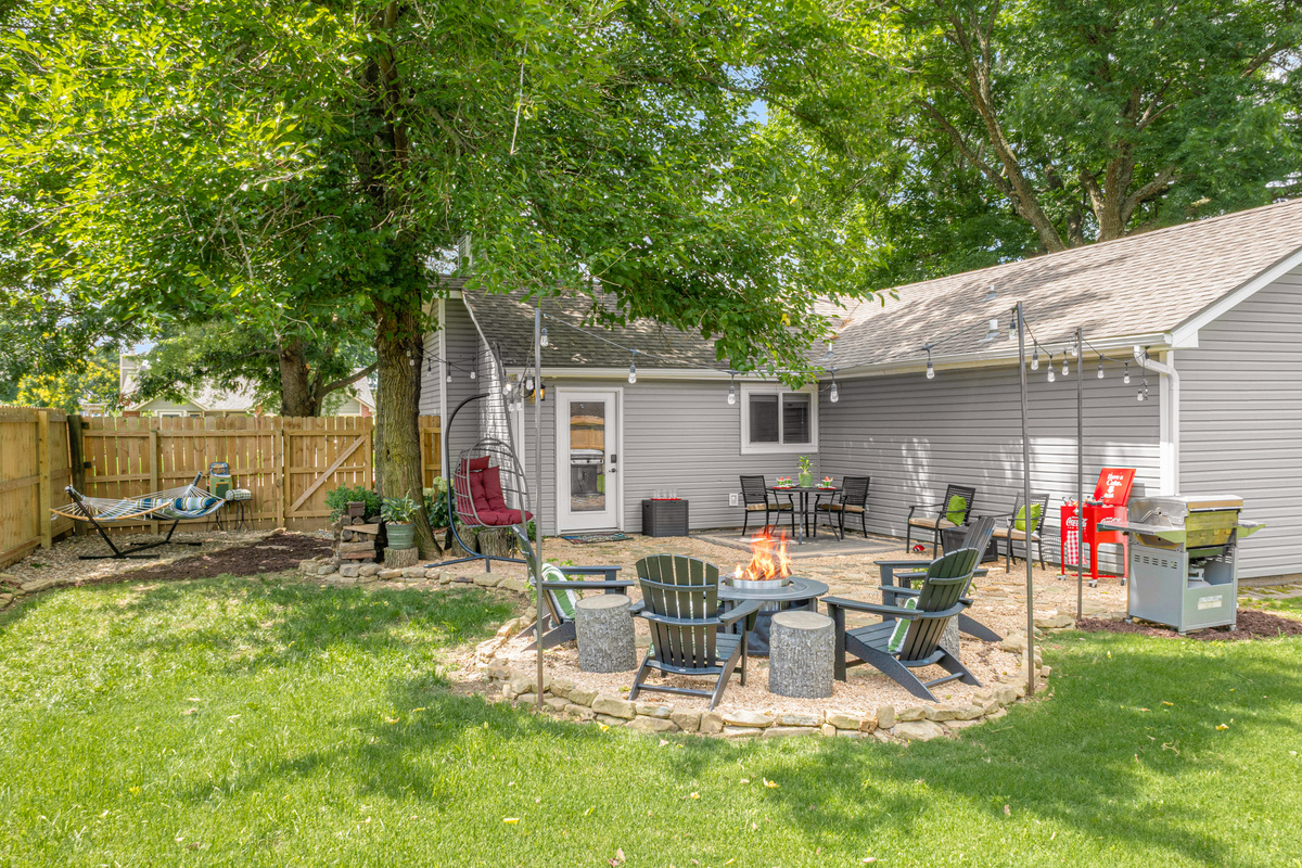 Your own private backyard oasis—gather around the fire pit, dine al fresco, or unwind in the hammock or hanging egg chair.