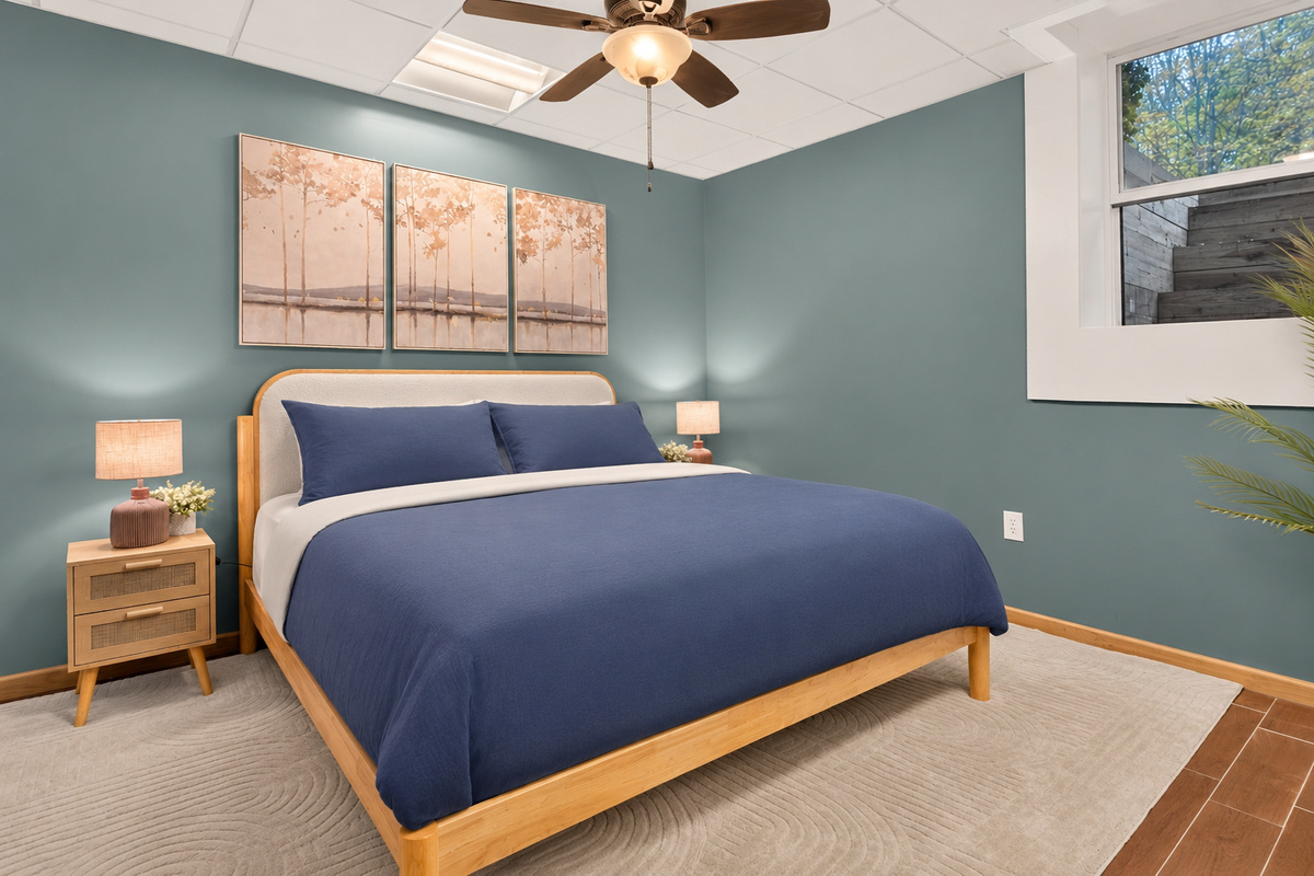 Bedroom with blue bedding and bedside lamps