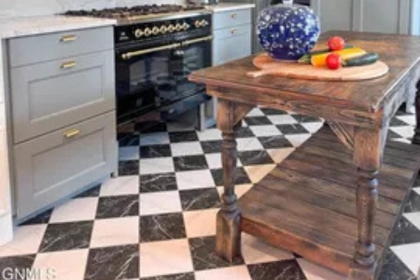 This island gives the kitchen extra room to spread out while cooking.