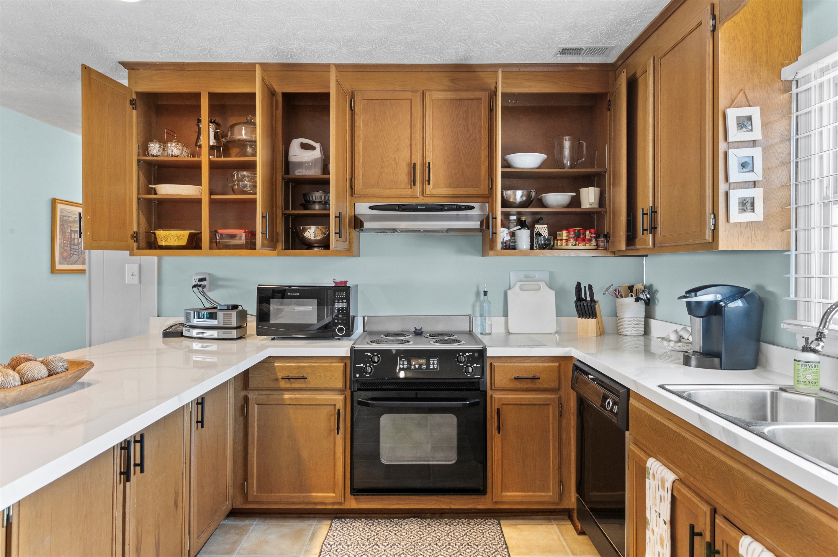 Kitchen Delight: Bright, spacious kitchen with modern appliances and charming decor awaits your culinary adventures!