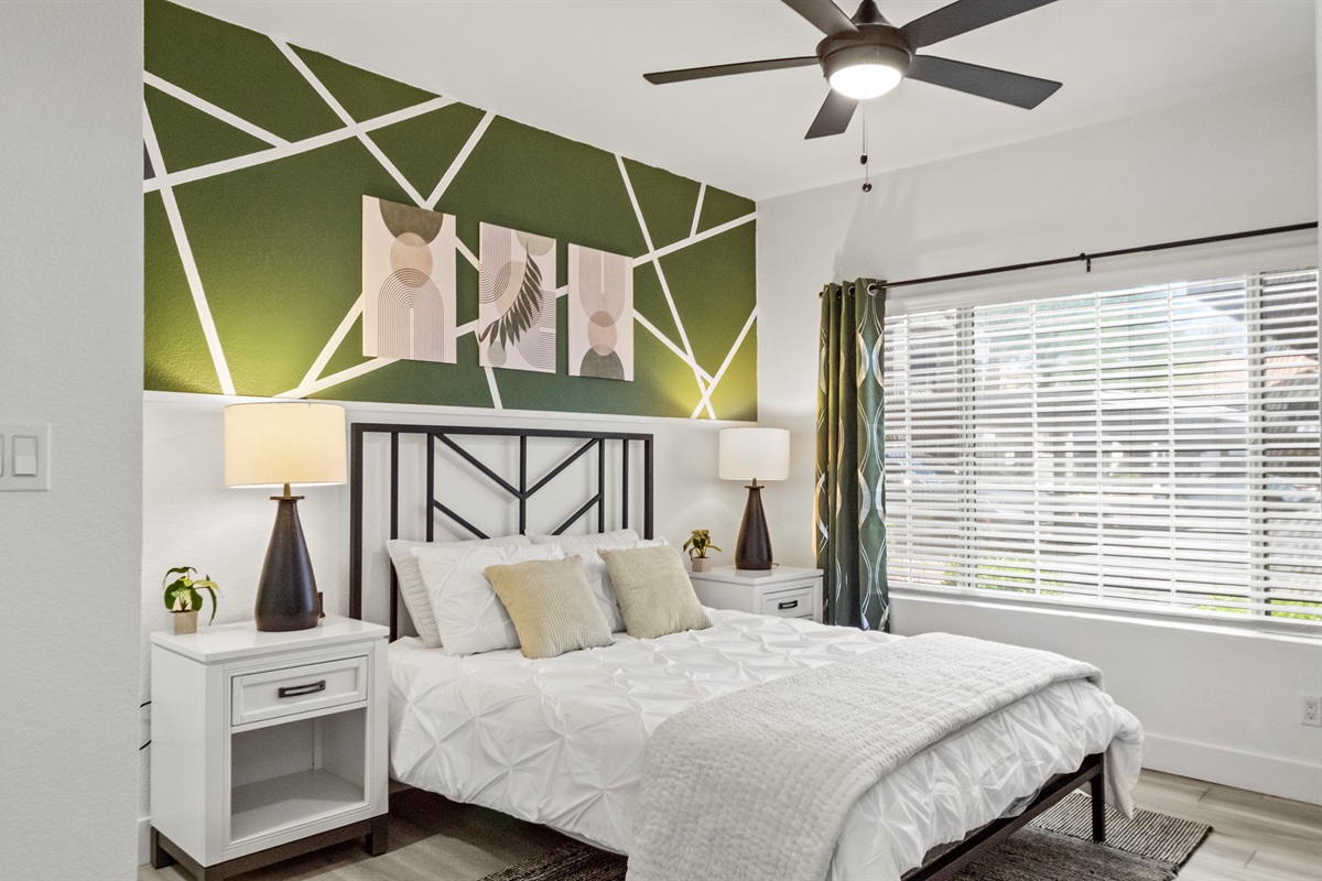 Spacious retreat with cozy bedding and modern style.