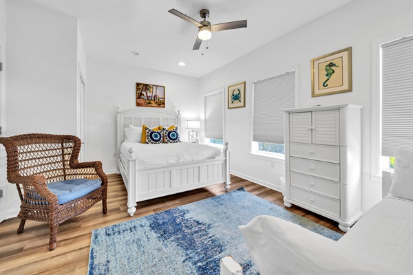 The second-floor bedroom has a queen bed and twin trundle and includes separate private access to the second-floor bathroom