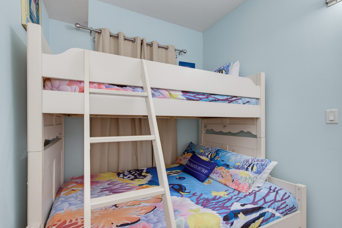 Private bunk room with a twin-over-full bunk bed and a TV.