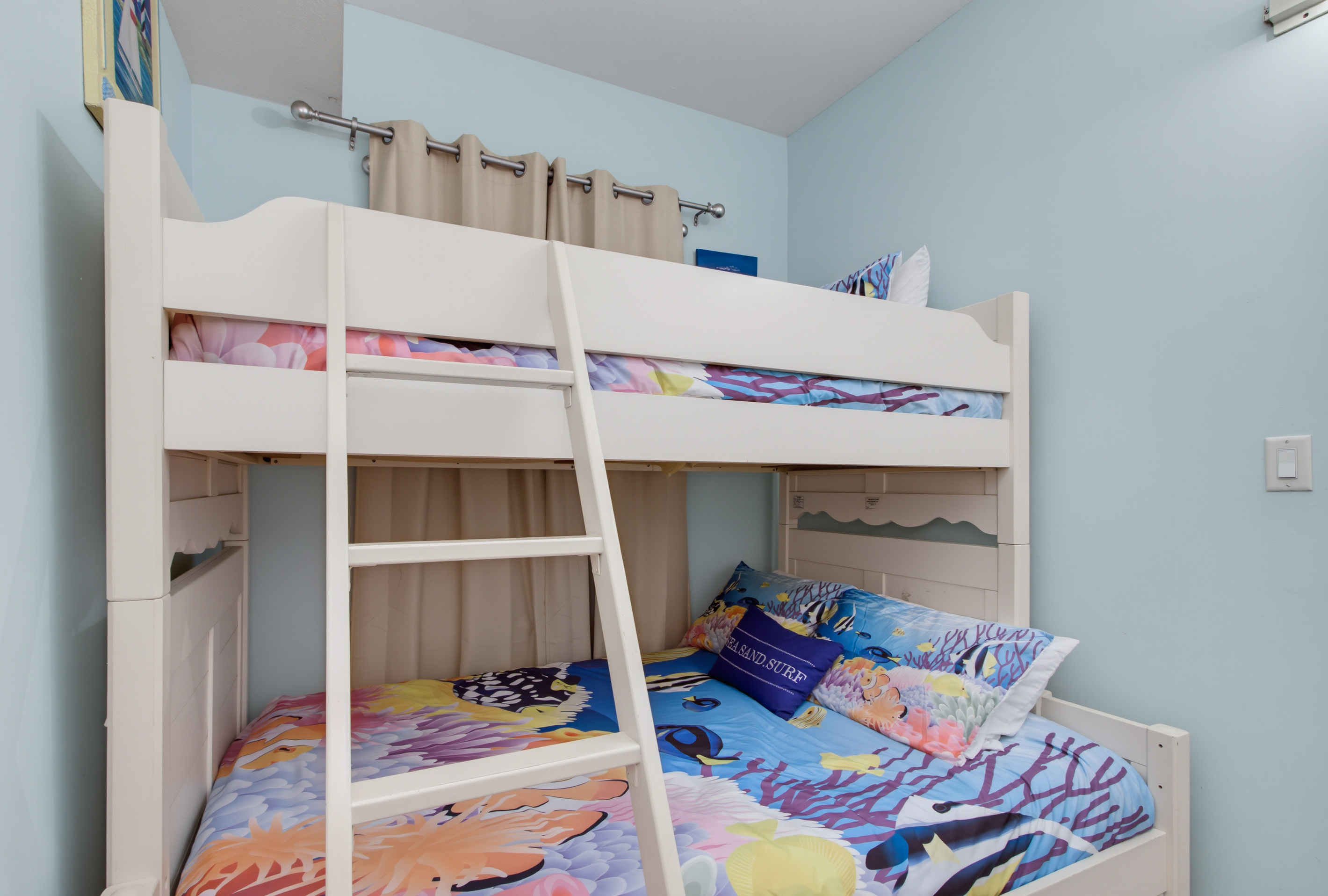 Private bunk room with a twin-over-full bunk bed and a TV.