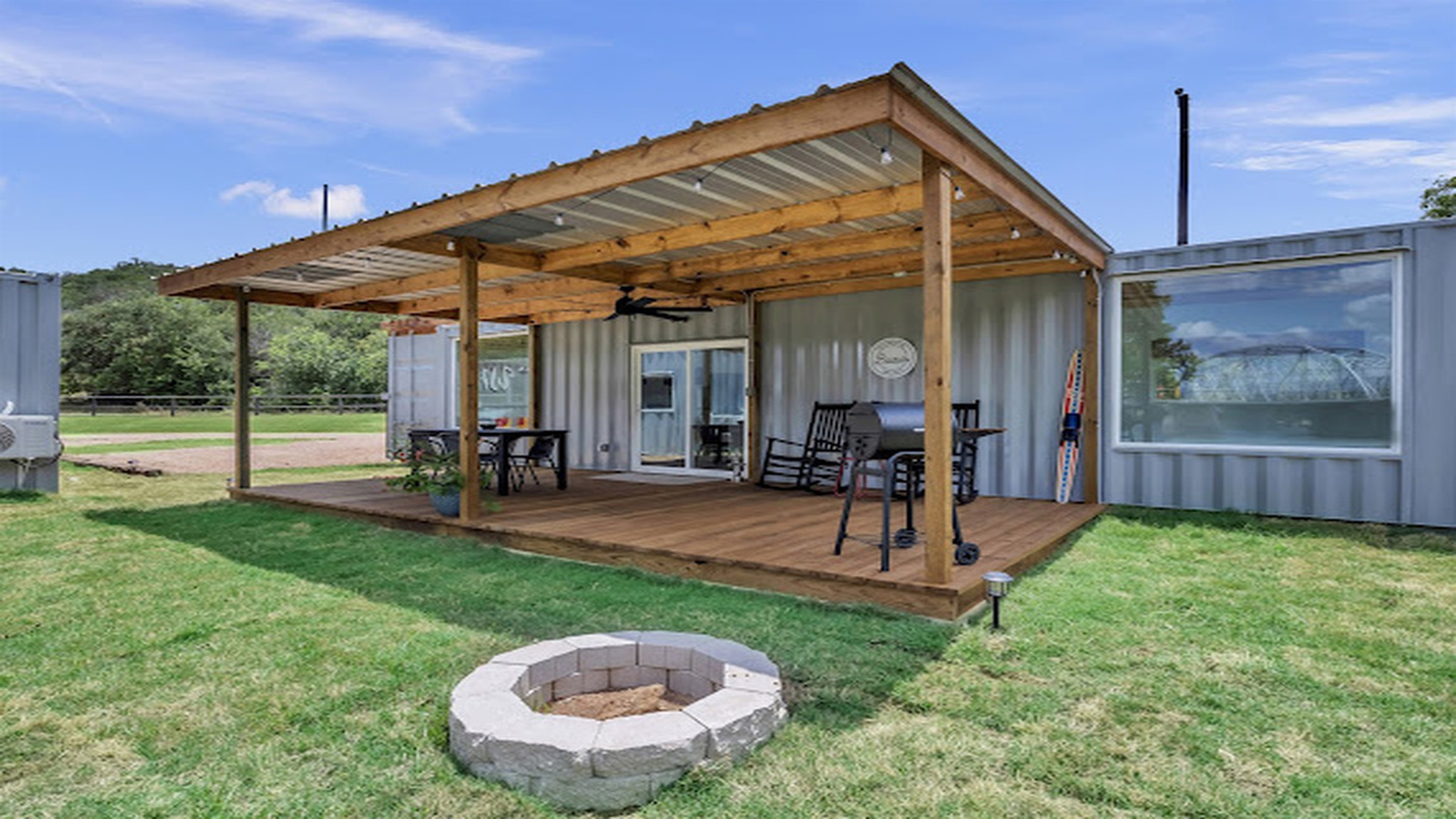 Unwind outdoors with a cozy fire pit and comfortable porch seating.