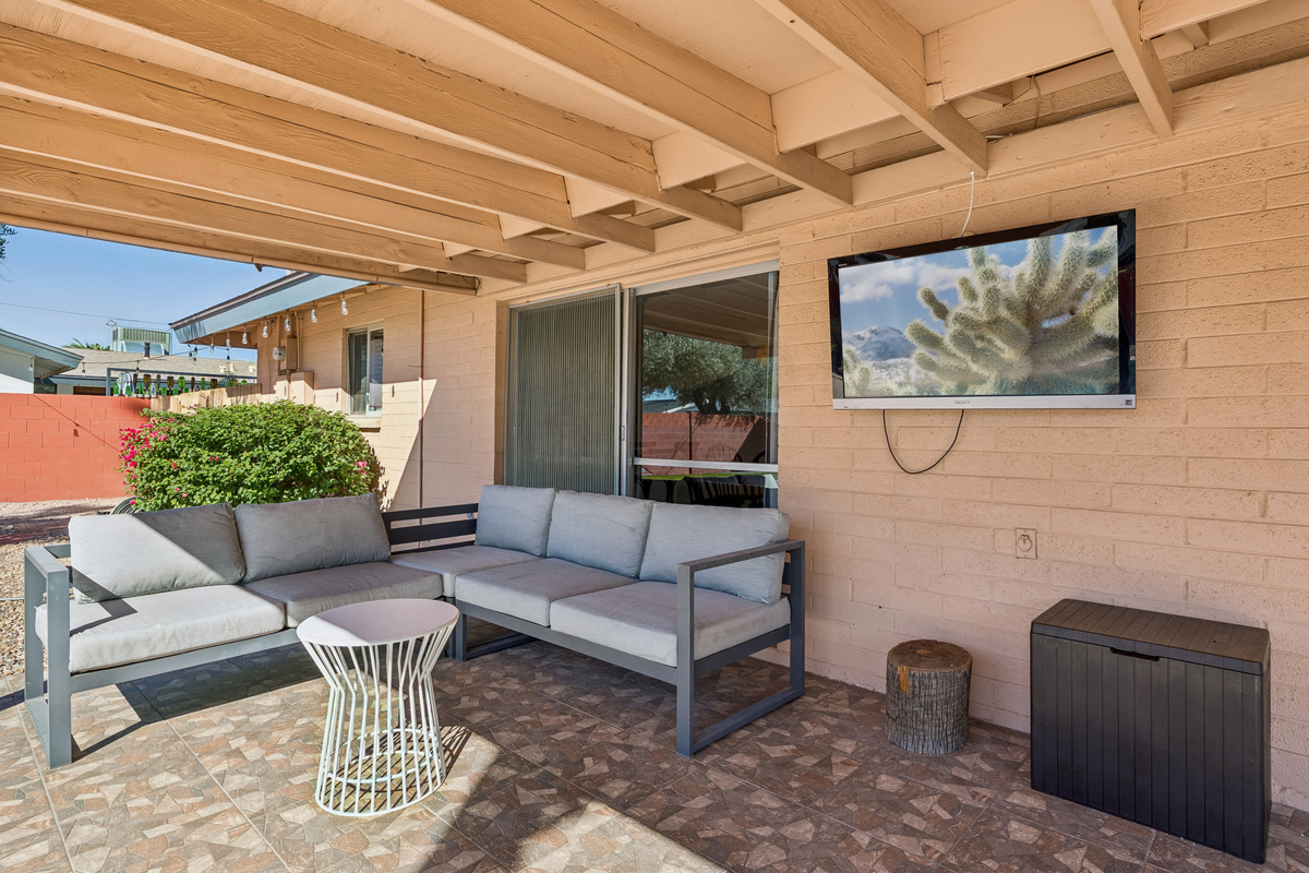 Soak up the activities in the back yard from this large covered patio!