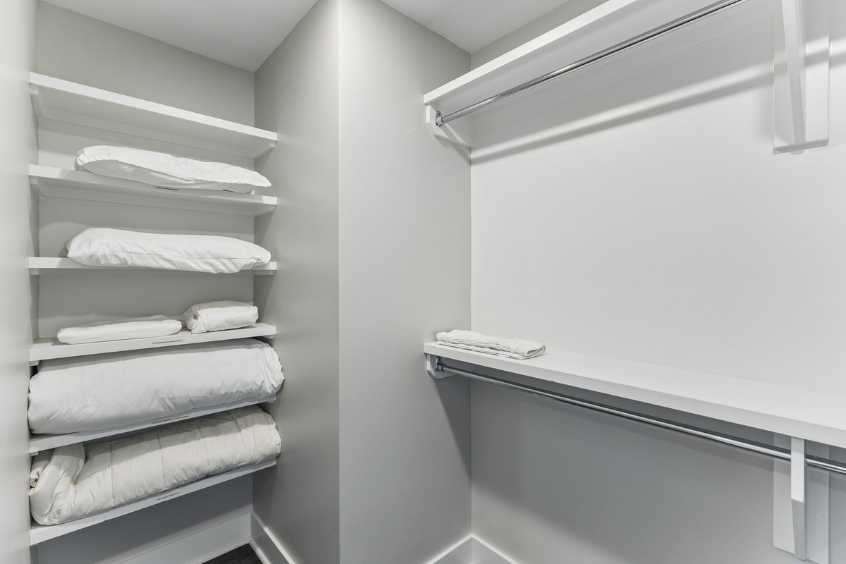 Unpack for real &mdash; the walk-in closet has double hanging rods and enough shelf space that your suitcase can stay on the floor.
