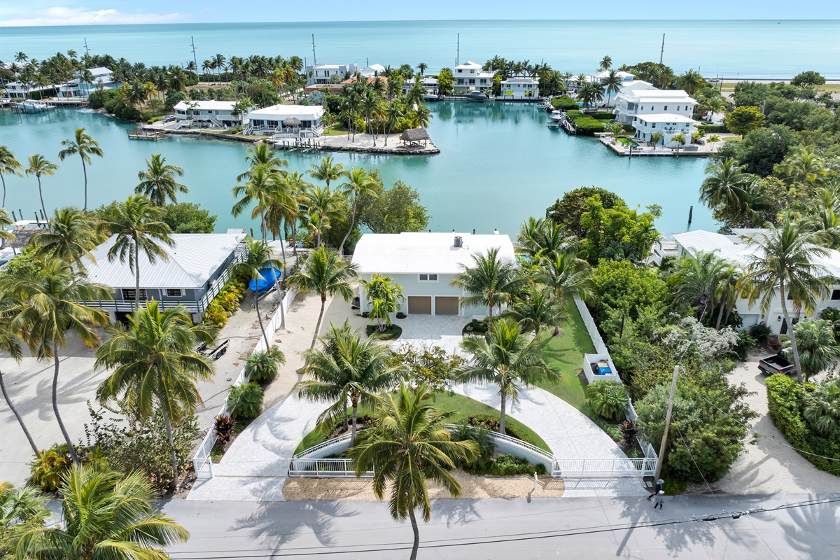 Aerial view of the home on a protected cove and the Atlantic Ocean just steps away.